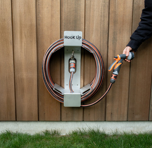 Hook Up Premium stainless steel garden hose reel mounted on a hose faucet/tap
